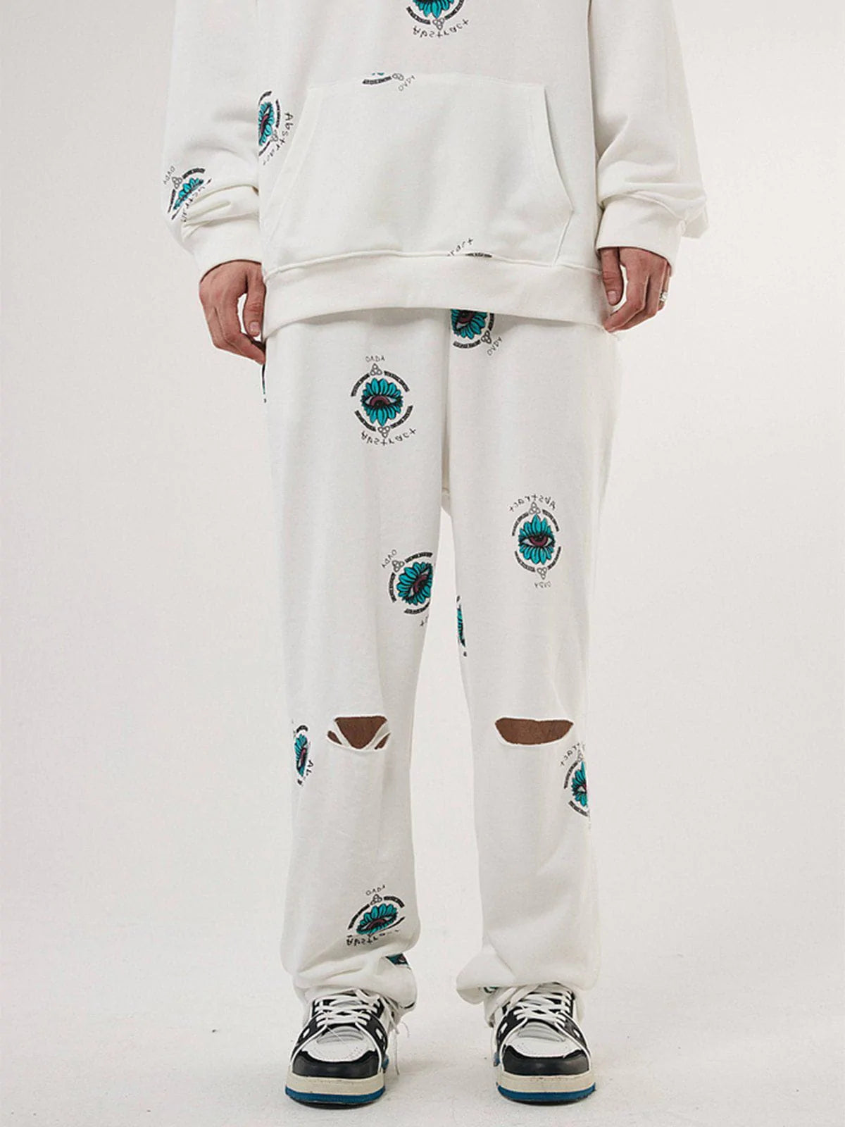 Youthful Blue Eye Print Pants with Shredded Detail